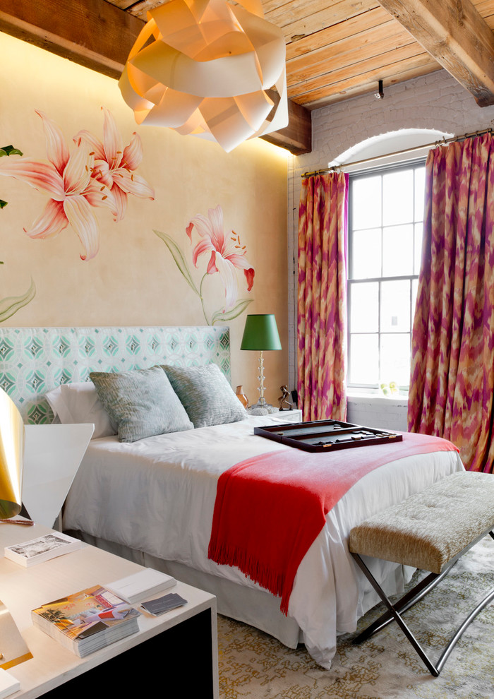 ikat pink print curtains girly bedroom bed red throw headboard upholstered paper lamp white brick walls decorating